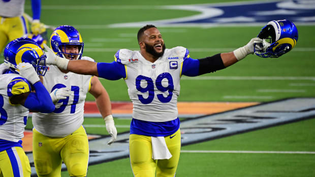 Feb 13, 2022; Inglewood, California, USA; Los Angeles Rams defensive tackle Aaron Donald (99) celebrates after a pressure in the fourth quarter against the Cincinnati Bengals in Super Bowl LVI at SoFi Stadium. Mandatory Credit: Gary A. Vasquez-USA TODAY Sports